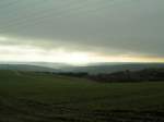 Die Sonne versucht sich am Rande der Wolken durch zu setzen ber der hgeligen Landschaft in der Nhe von Lipperscheid (Luxemburg). 01.11.07