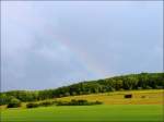 Regenbogen Ansatz eines Regenbogens fotografiert am 27.06.08 in Erpeldange/Wiltz. Leider verschwand die Sonne wieder, sodass der Regenbogen keine Chance hatte sich voll zu entwickeln. (Jeanny)
