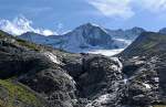 Pinzgau Wasserfall am Ende des Ger�llfeldes vom Wildgerloskees.

(Anfang des letzten Jahrhunderts reichte das Eis des Gletschers noch bis an den oberen Rand der rechtsseitig abgebildeten Flanke der Schutthalde...)