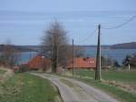 Am Kleinen Jasmunder Bodden und in einer Talsenke liegt das Drfchen Buschvitz.Aufnahme am 10.April 2011.