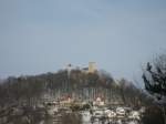 Der verschneite  Hgel  von der Burg Falkenstein