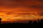 Mnchen. Sonnenuntergang mit Stadtpanorama.