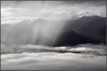 Regen und etwas Sonne -     Blick vom Brienzer Rothorn zu den Berner Alpen.