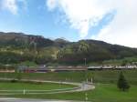 im Kanton Tessin, St. Gotthard Südausgang mit der Bahnstation Airolo, Foto aus dem fahrenden Bus am 14.5.2014
