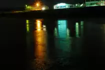 Farbenspiel bei Eyrichshof(bei Ebern)im Winter.Der Wiesengrund ist erst �berschwemmt,dann gefroren.Das kleine Industriegebiet spiegelt sich dann bei Nacht.